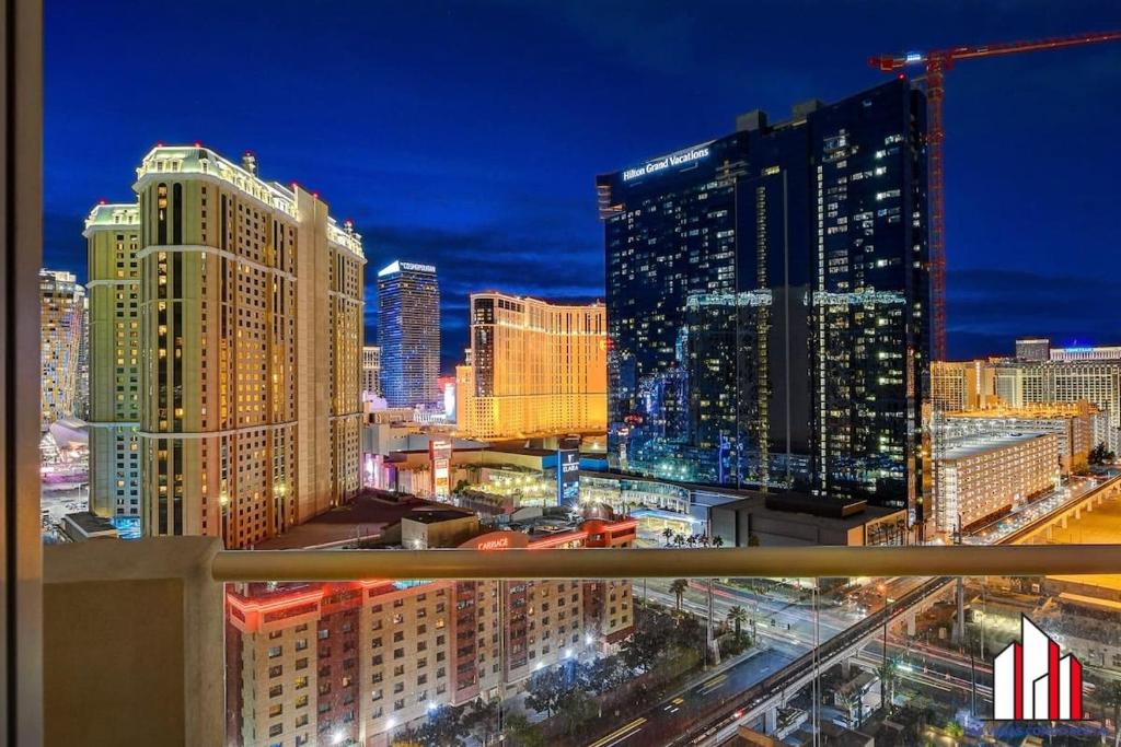 a view of a city skyline at night at MGM Signature-18-701 1Br2Ba Strip View Balcony in Las Vegas