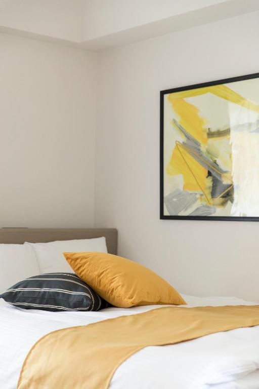 SG RESIDENCE INN HAKATAにあるベッド