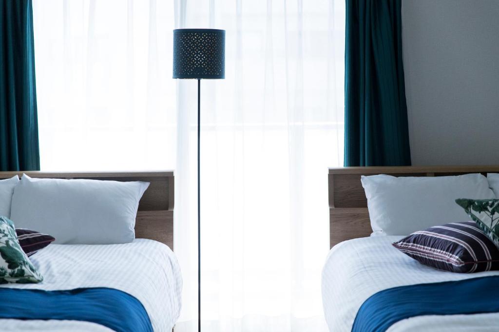 SG RESIDENCE INN HAKATAにあるベッド