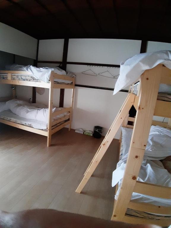 Postel nebo postele na pokoji v ubytování guest house komoriya