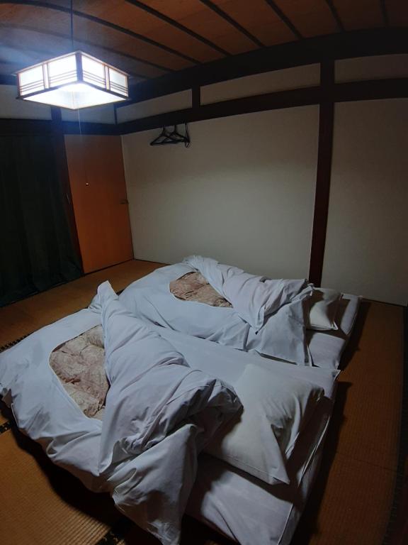 Postel nebo postele na pokoji v ubytování guest house komoriya