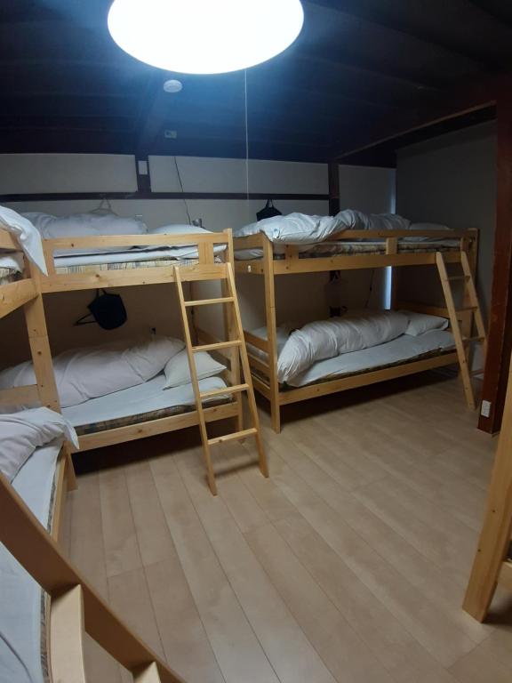 Postel nebo postele na pokoji v ubytování guest house komoriya