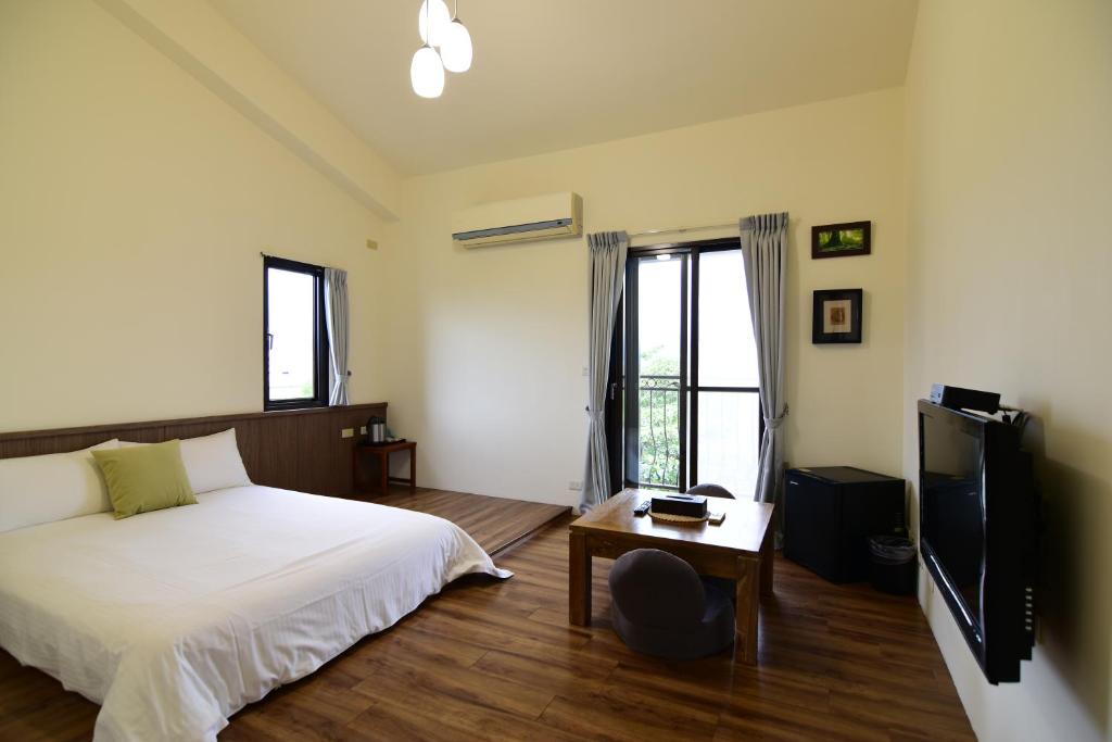 Postel nebo postele na pokoji v ubytování Landay Homestay