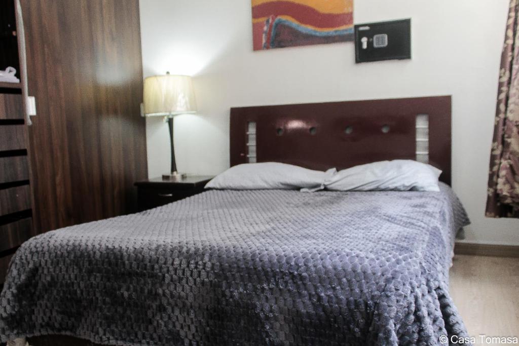 Postel nebo postele na pokoji v ubytování Casa Tomasa