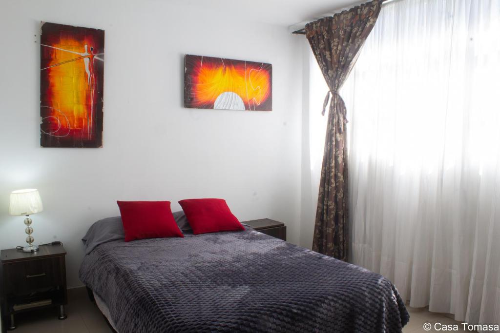 Postel nebo postele na pokoji v ubytování Casa Tomasa