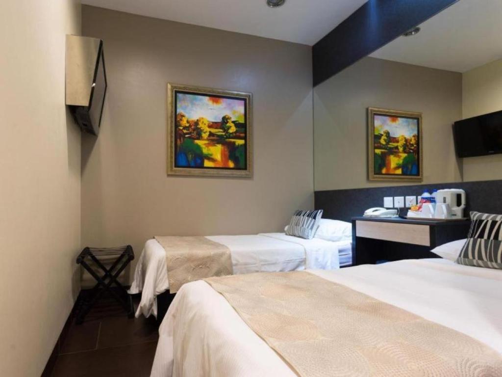 Postel nebo postele na pokoji v ubytování Value Hotel Nice
