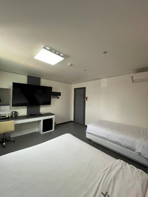 Postel nebo postele na pokoji v ubytování Motel Choo Eok