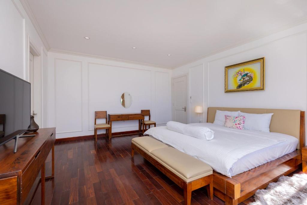 Ein Bett oder Betten in einem Zimmer der Unterkunft Biệt Thự Lan Anh Đà Lạt