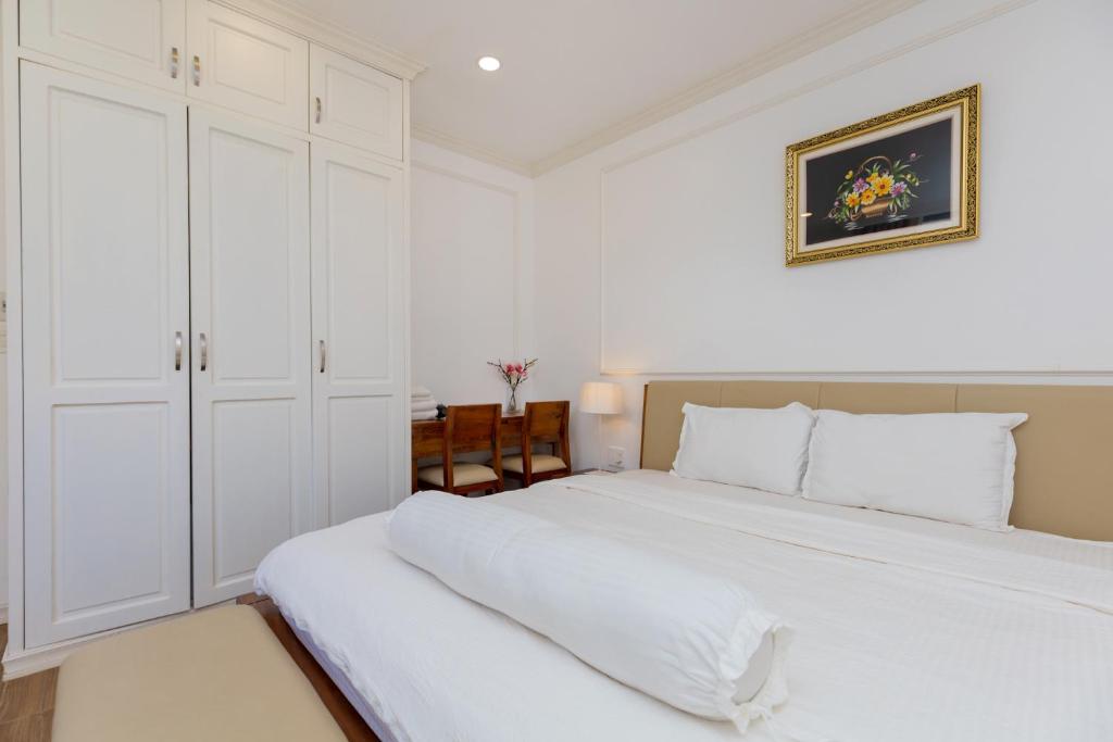 Ein Bett oder Betten in einem Zimmer der Unterkunft Biệt Thự Lan Anh Đà Lạt