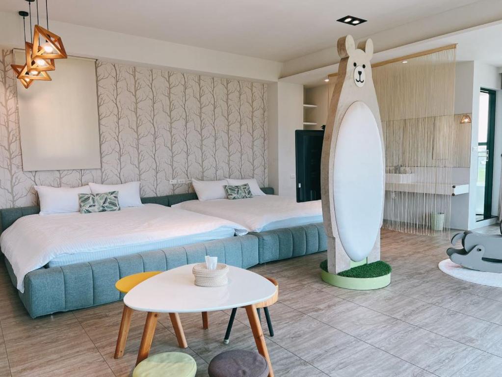 Postel nebo postele na pokoji v ubytování Wei Wei Chu B&B