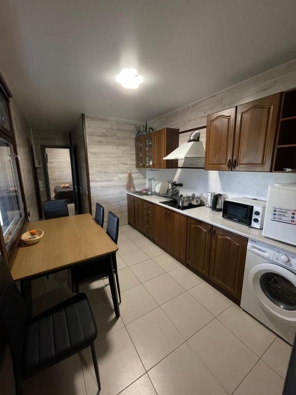 Kuchyň nebo kuchyňský kout v ubytování Hotel Voyage Вояж