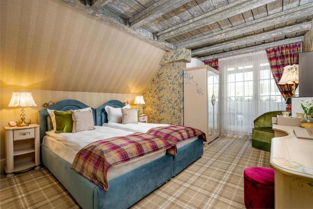 Postel nebo postele na pokoji v ubytování Casa Timiș - Wellness & Spa Resort