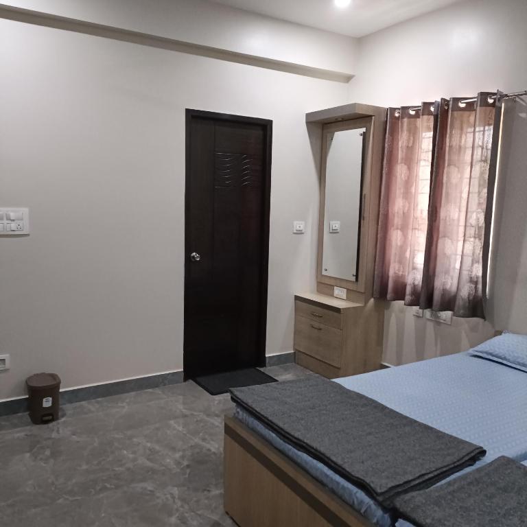 Postel nebo postele na pokoji v ubytování Sukrithi Premium Serviced Apartment - F2