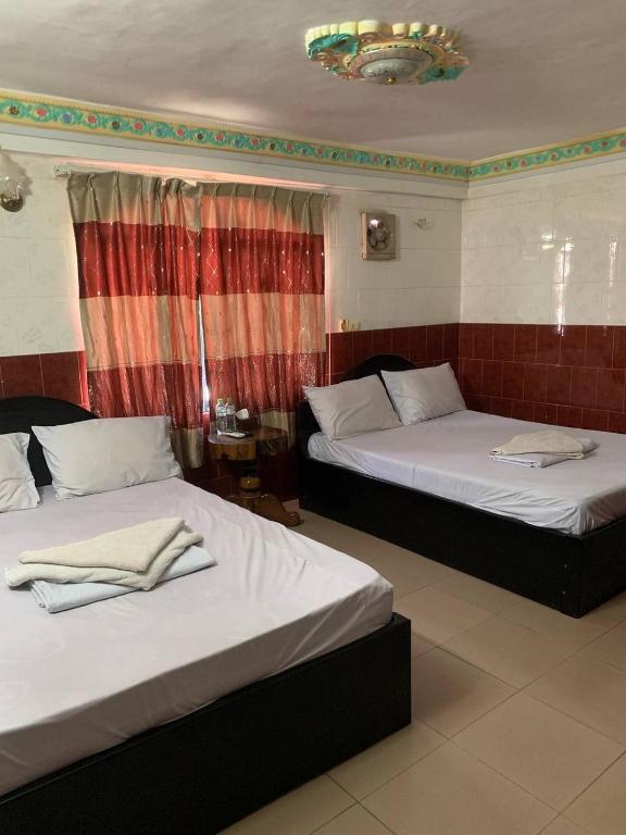 Postel nebo postele na pokoji v ubytování Ditar Guest House D