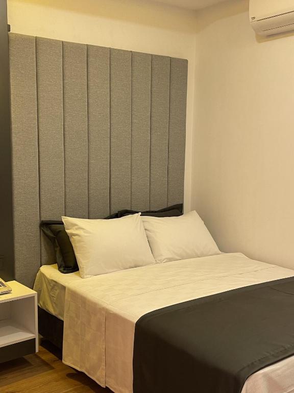 Postel nebo postele na pokoji v ubytování Mi Hotel Boutique