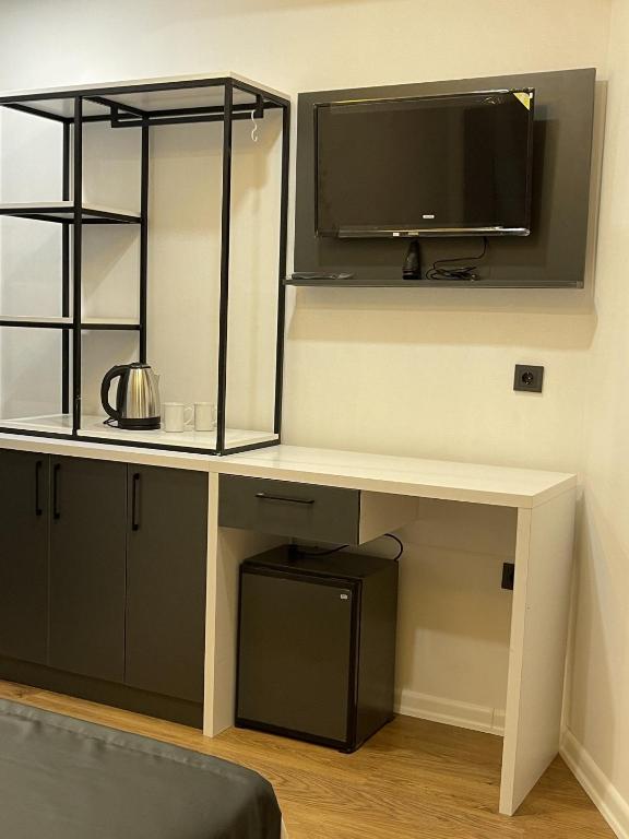 TV a/nebo společenská místnost v ubytování Mi Hotel Boutique