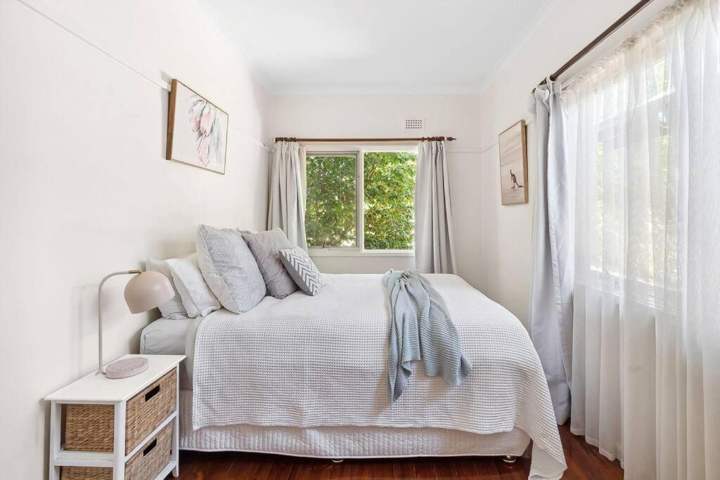 Postel nebo postele na pokoji v ubytování Capital Cottage