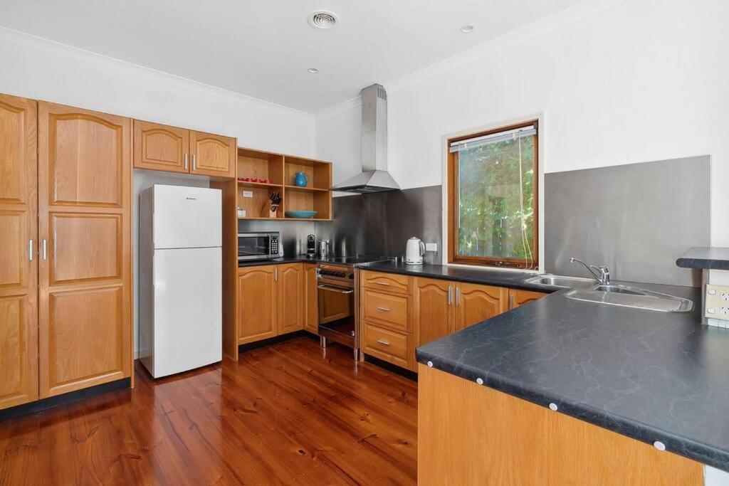Kuchyň nebo kuchyňský kout v ubytování Capital Cottage