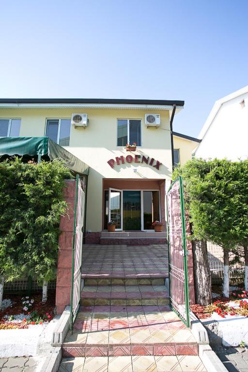 a entrance to a hotel with a sign on it at CASA PHOENIX in Eforie Nord