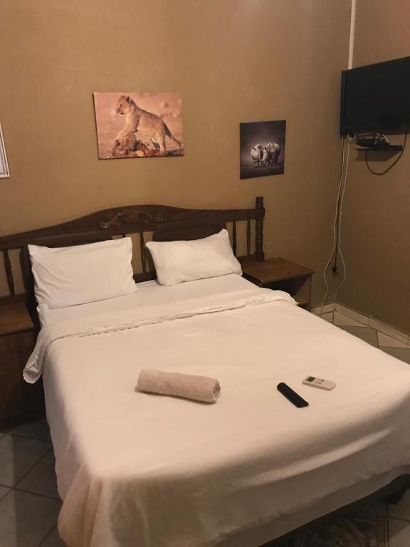 Tempat tidur dalam kamar di Good living Guesthouse