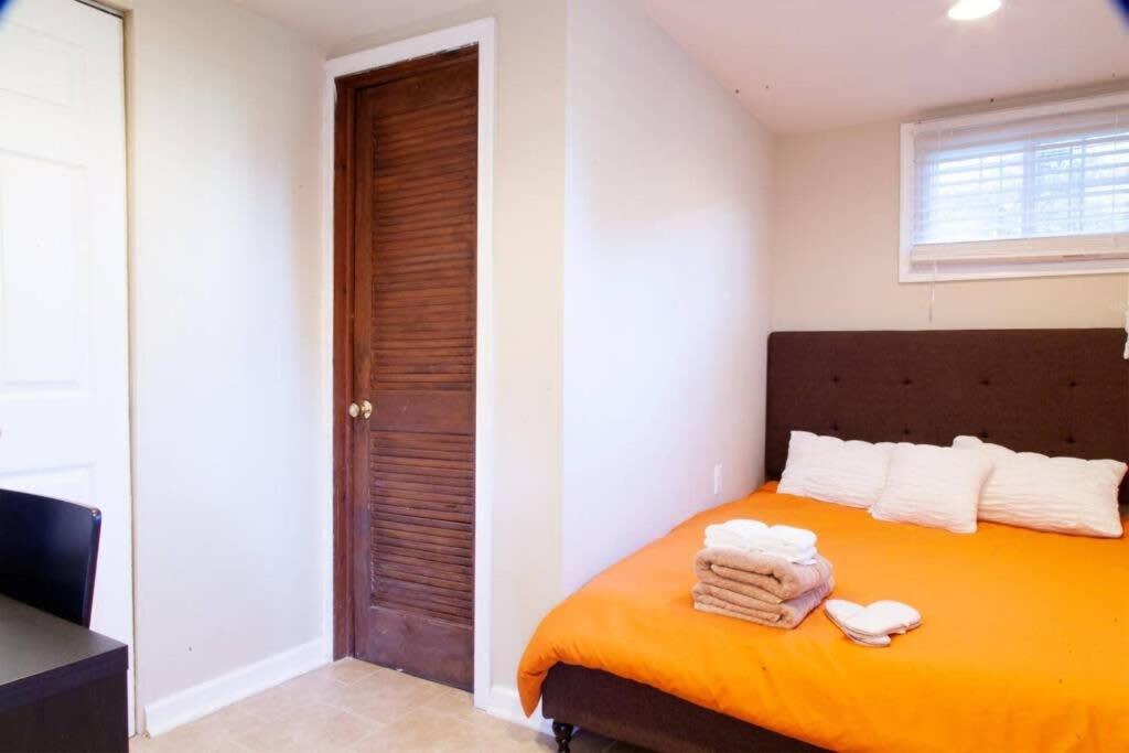 a bedroom with a bed with towels on it at 1BR Oasis near Takoma Metro Minutes to Capital in Washington, D.C.