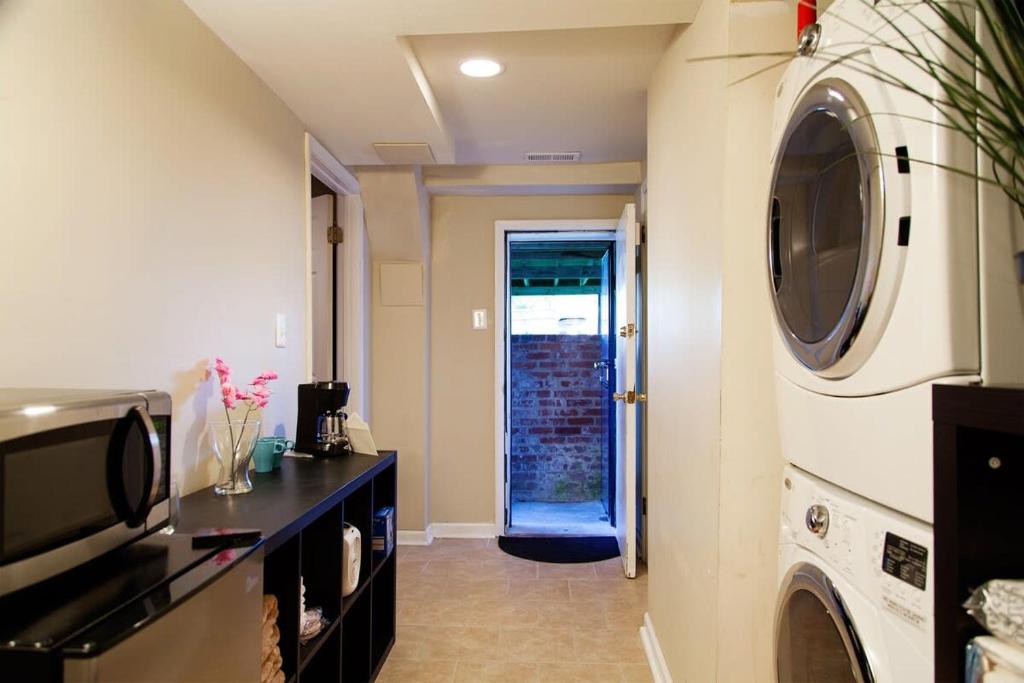 a laundry room with a washer and dryer at 1BR Oasis near Takoma Metro Minutes to Capital in Washington, D.C.