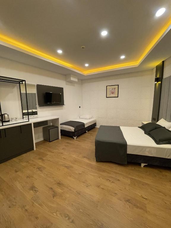 TV a/nebo společenská místnost v ubytování Mi Hotel Boutique