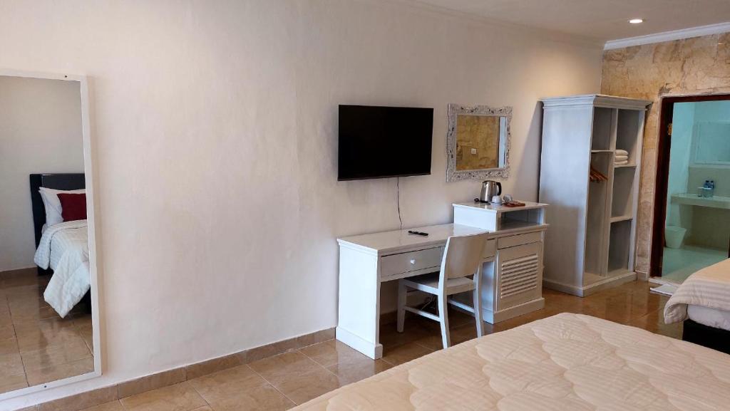 Postel nebo postele na pokoji v ubytování Grand Melka Hotel