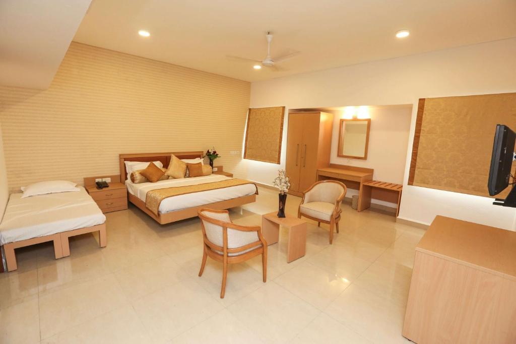 TV a/nebo společenská místnost v ubytování Avenue 11 Boutique Residences, Poes Garden Chennai