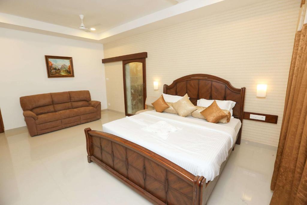 Postel nebo postele na pokoji v ubytování Avenue 11 Boutique Residences, Poes Garden Chennai