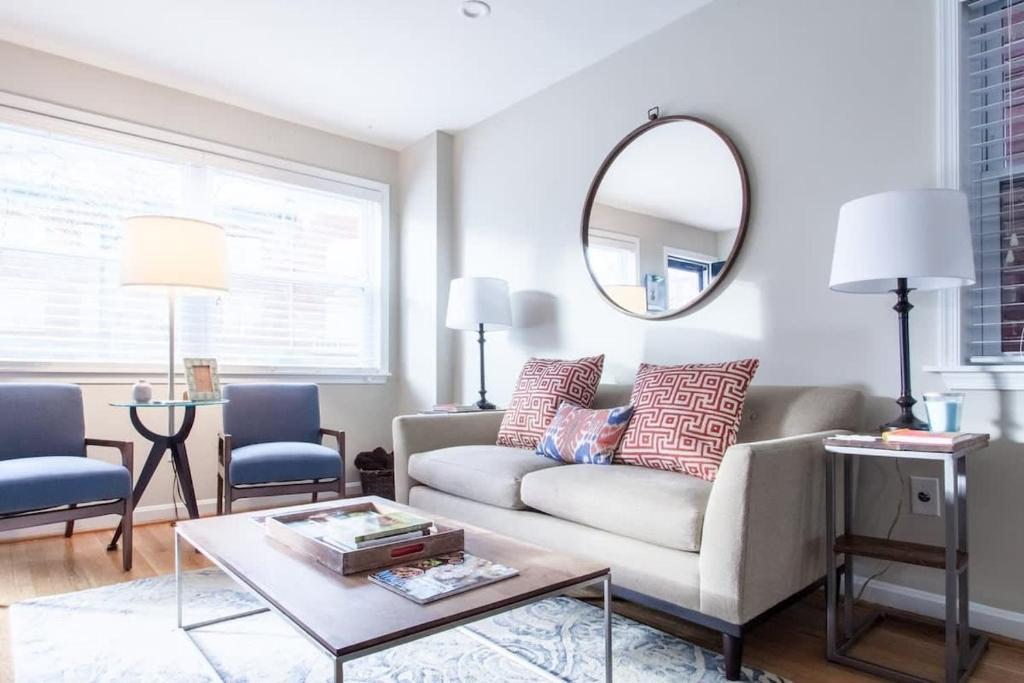 a living room with a couch and a table at Transit-Friendly Home Old Town Parking in Alexandria