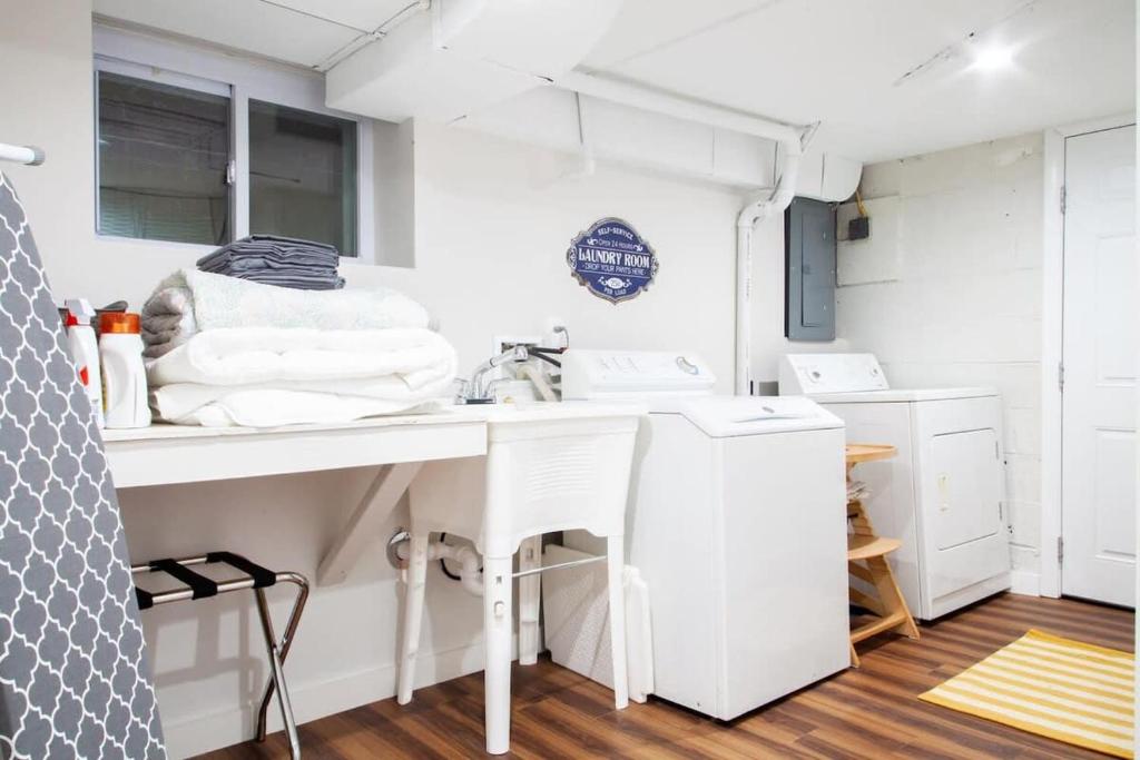 a kitchen with a counter and a sink in a trailer at Transit-Friendly Home Old Town Parking in Alexandria