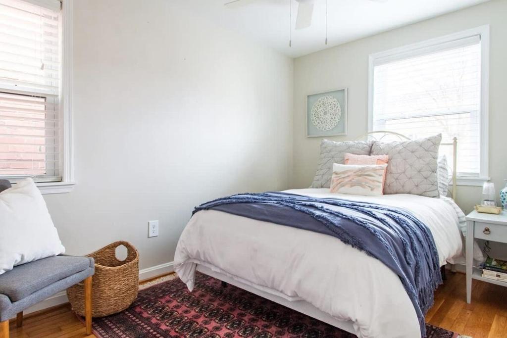 a bedroom with a bed and a chair at Transit-Friendly Home Old Town Parking in Alexandria