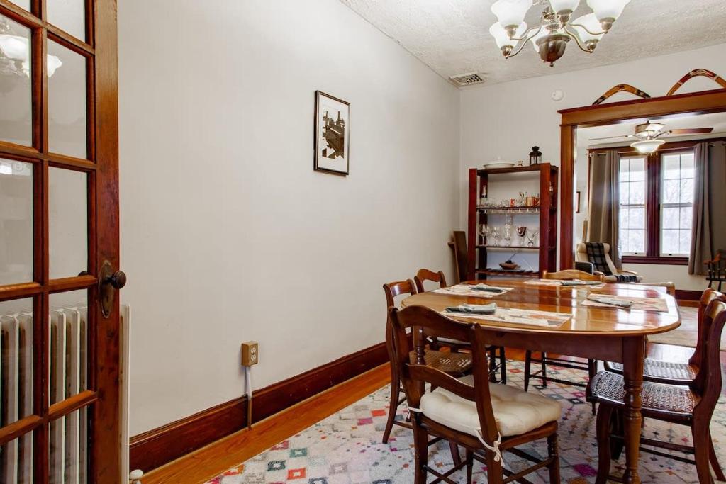 a dining room with a wooden table and chairs at The E St Retreat Lovely 3-BR Nestled between H St & Eastern Market in Washington, D.C.