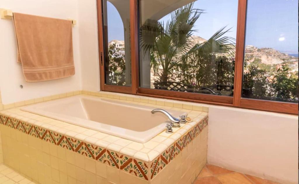 a bath tub in a bathroom with a window at Infinite views of Palmilla beach and East Cape in San José del Cabo