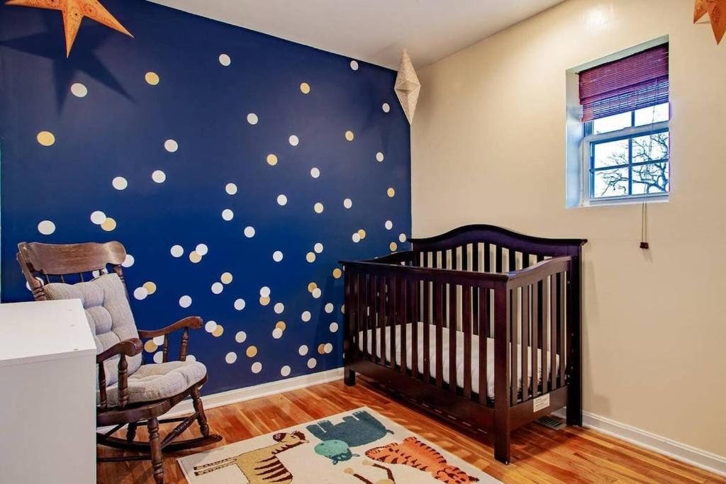 a baby room with a crib and a star wall at Family-friendly Home for travelers Near subway in Washington, D.C.