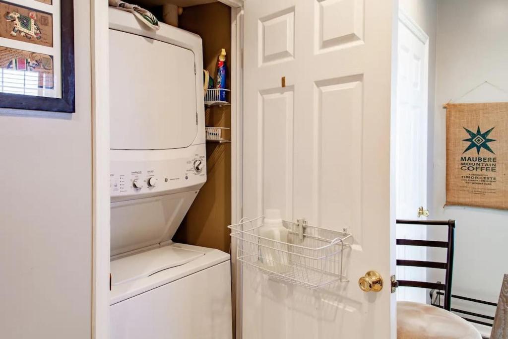 a white washer and dryer sitting in a kitchen at Family-friendly Home for travelers Near subway in Washington, D.C.