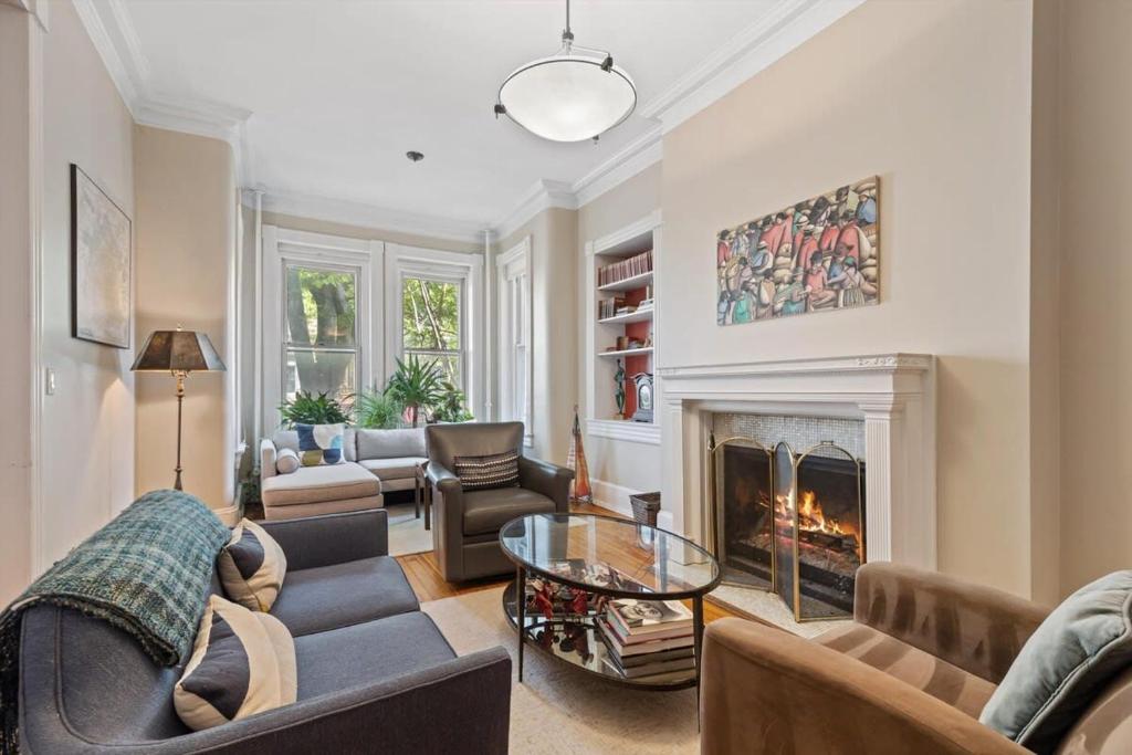 a living room filled with furniture and a fireplace at Capitol Hill Homestay Convenient to H St in Washington, D.C.