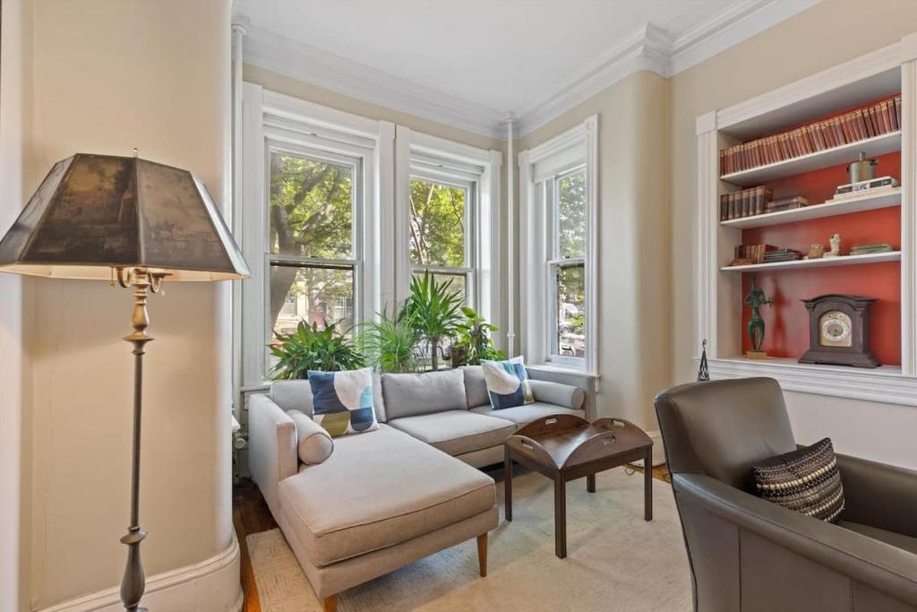 a living room with a couch and a chair at Capitol Hill Homestay Convenient to H St in Washington, D.C.