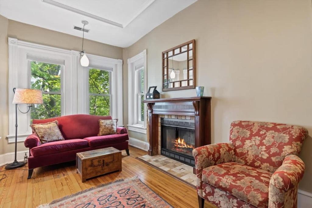 a living room with a couch and a fireplace at Historic Capital Hill Home and Carriage House in Washington, D.C.