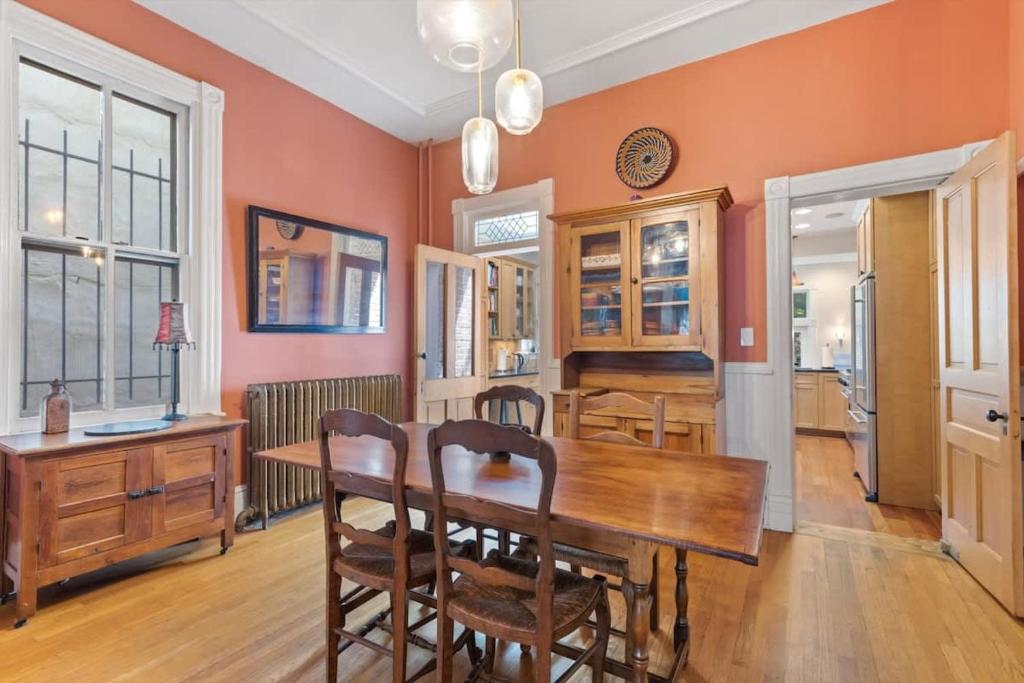 a dining room with a wooden table and chairs at Historic Capital Hill Home and Carriage House in Washington, D.C.