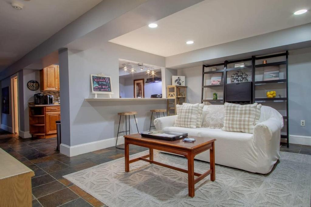 a living room with a white couch and a table at Delightful 1-BR Accommodations Nearby METRO in Washington, D.C.