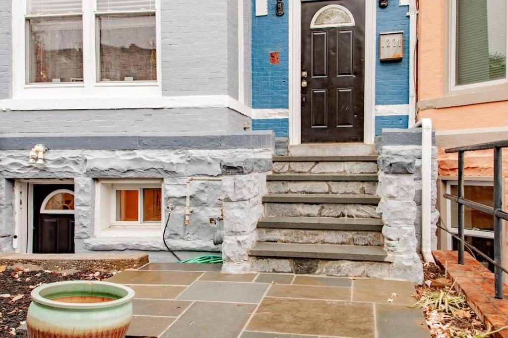 a house with a front door and a pot in front at Stay Cozy in CoHi DC in Washington, D.C.
