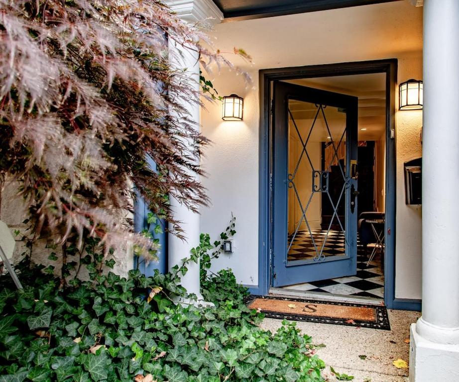 an entrance to a house with a blue door at LUXE Kalorama 5-BR Townhome Close to Dupont Circle in Washington, D.C.