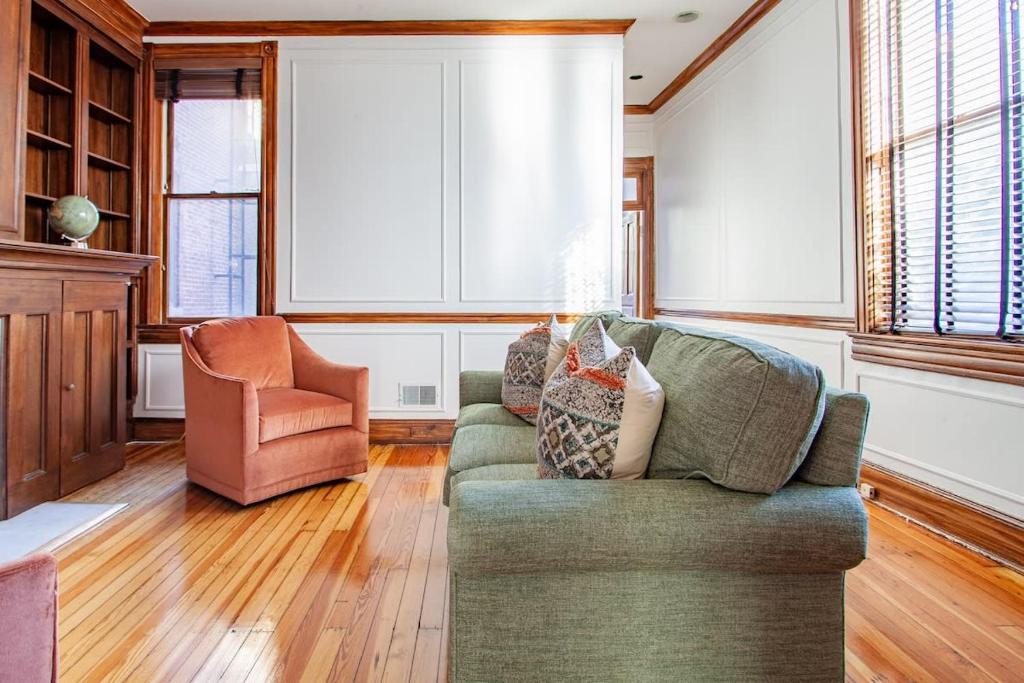 a living room with a couch and a chair at LUXE Kalorama 5-BR Townhome Close to Dupont Circle in Washington, D.C.