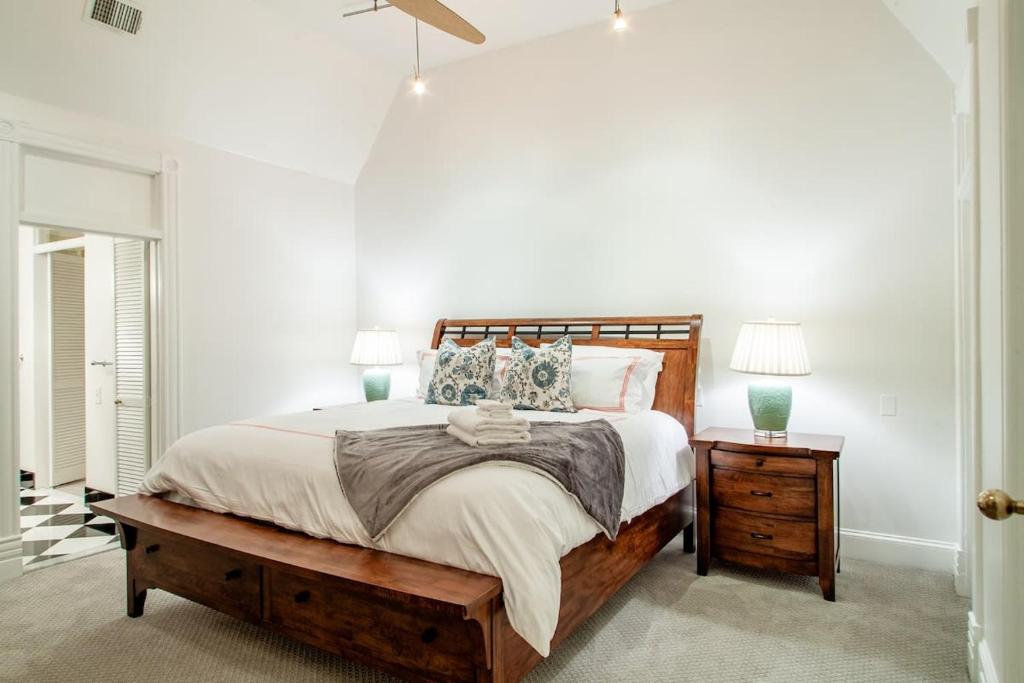 a bedroom with a large bed and two night stands at LUXE Kalorama 5-BR Townhome Close to Dupont Circle in Washington, D.C.