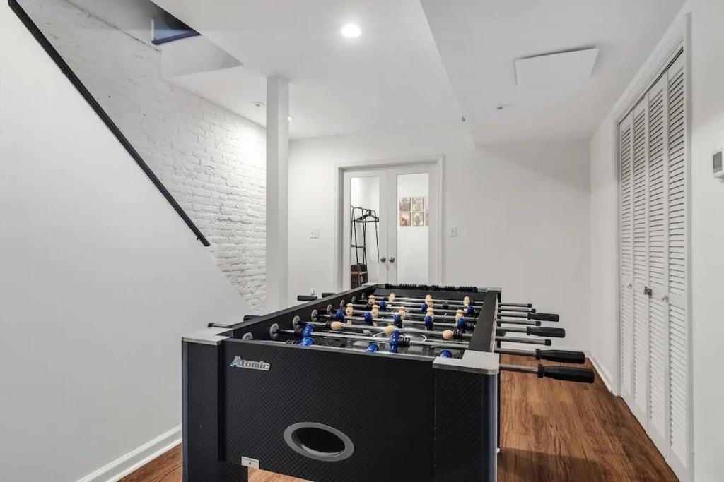 a large room with a large game table at H St DC Haven 4-BR Homestay in Washington, D.C.