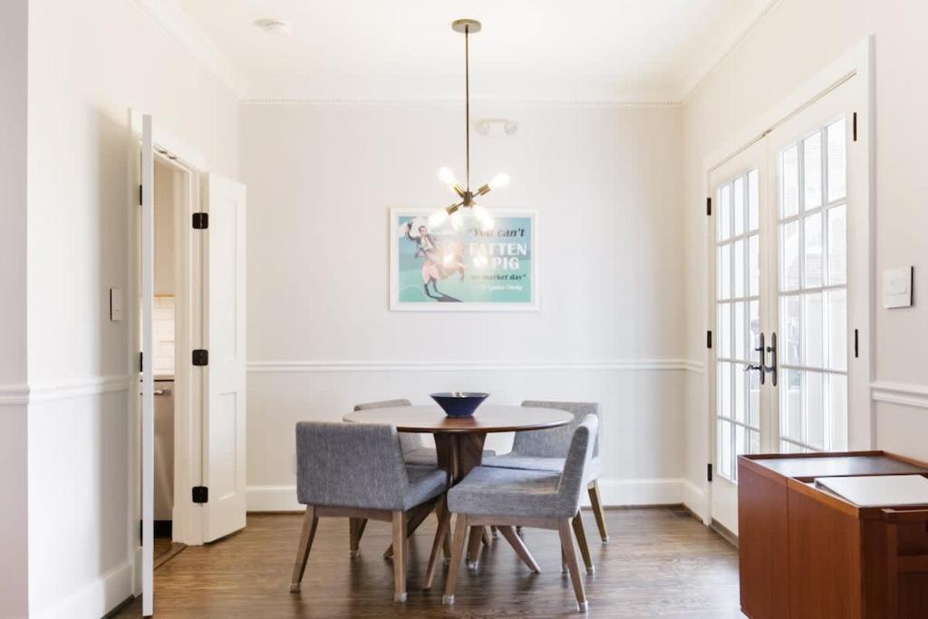 a dining room with a table and chairs at Historic Charming Home in Old Town in Alexandria