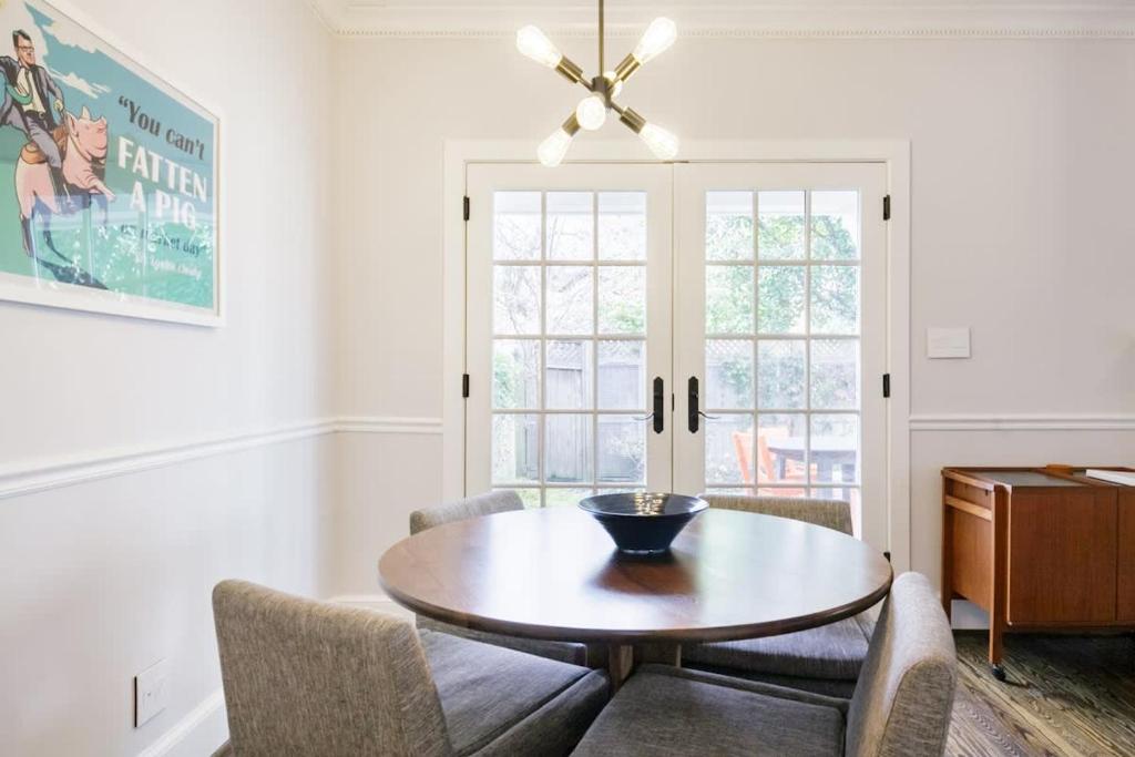 a dining room with a table and chairs at Historic Charming Home in Old Town in Alexandria