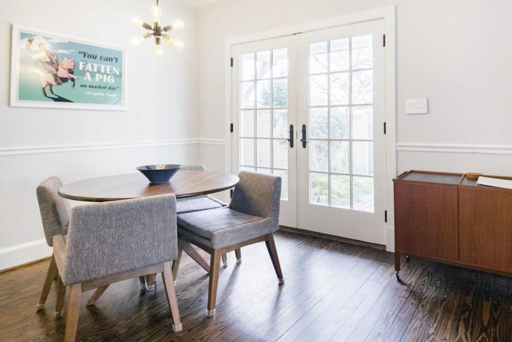 a dining room with a wooden table and chairs at Historic Charming Home in Old Town in Alexandria